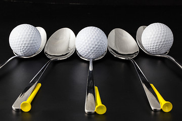 Image showing Spoons and golf balls 