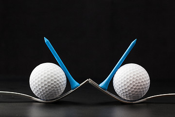 Image showing Golf balls on the black background