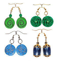 Image showing Earrings made of plastic and glass on a white background blue an