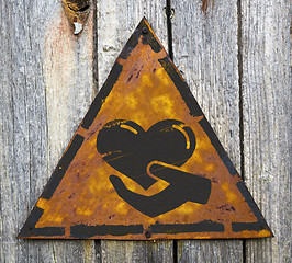 Image showing Charity Concept on Weathered Warning Sign.