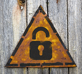 Image showing Icon of Opened Padlock on Rusty Warning Sign.