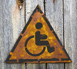 Image showing Disabled Icon on Rusty Warning Sign.