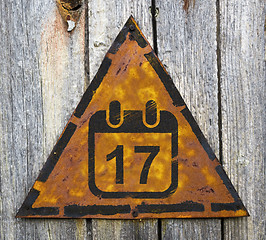 Image showing Calendar with Date Icon on Rusty Warning Sign.
