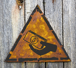 Image showing Icon of Money in the Hand on Rusty Warning Sign.