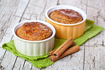 Image showing two fresh baked buns and cinnamon sticks