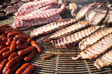 Image showing Assorted meat being grilled