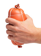 Image showing Hand with sausage