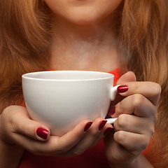 Image showing woman holding hot cup