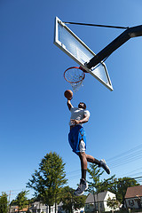 Image showing Basketball Player Dunking