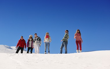 Image showing friends have fun at winter on fresh snow