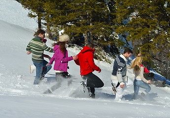 Image showing friends have fun at winter on fresh snow