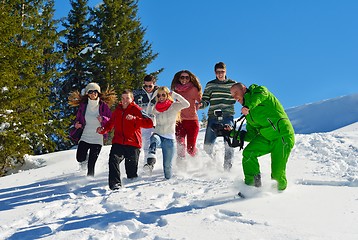 Image showing friends have fun at winter on fresh snow