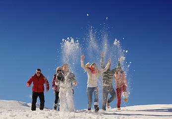 Image showing friends have fun at winter on fresh snow