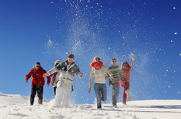 Image showing friends have fun at winter on fresh snow