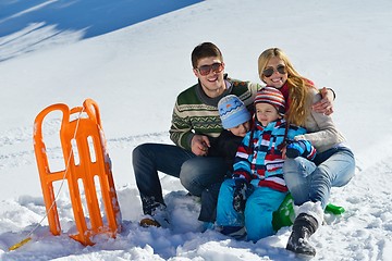 Image showing family having fun on fresh snow at winter vacation