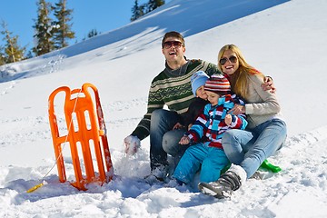 Image showing family having fun on fresh snow at winter vacation