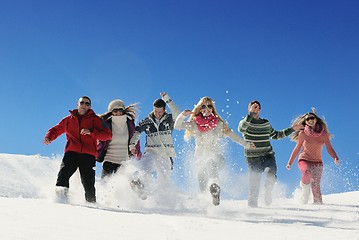 Image showing friends have fun at winter on fresh snow