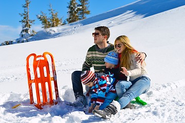 Image showing family having fun on fresh snow at winter vacation