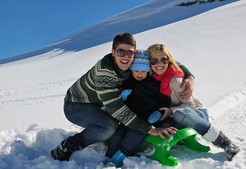 Image showing family having fun on fresh snow at winter vacation