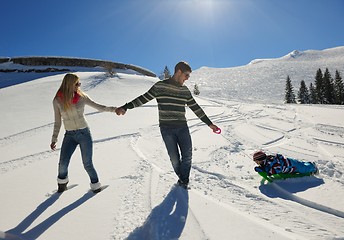 Image showing family having fun on fresh snow at winter vacation