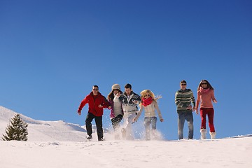 Image showing friends have fun at winter on fresh snow