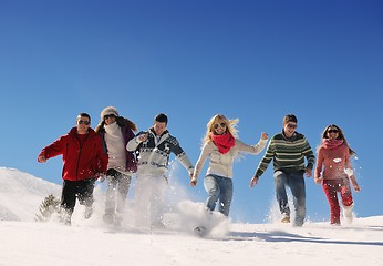 Image showing friends have fun at winter on fresh snow