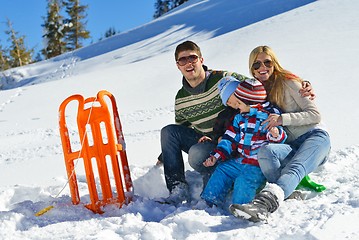 Image showing family having fun on fresh snow at winter vacation