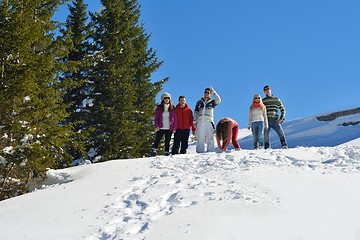 Image showing friends have fun at winter on fresh snow