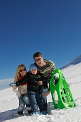 Image showing family having fun on fresh snow at winter vacation