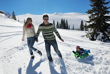 Image showing family having fun on fresh snow at winter vacation