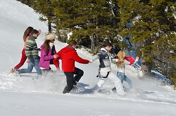 Image showing friends have fun at winter on fresh snow