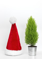 Image showing Santa hat and little Christmas tree