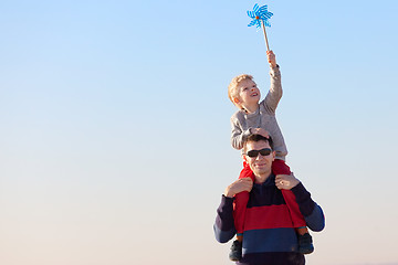 Image showing family with pinwheel