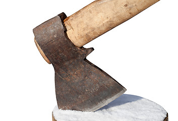 Image showing Axe and log with snow. Close-up view.