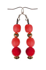 Image showing Earrings of red beads with gold elements on a white background