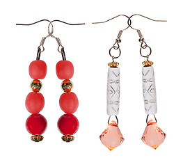 Image showing Earrings- pendants with sequins and red beads on white backgroun