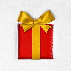 Image showing gift with a bow on snow background