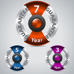 Image showing Metallic warranty badges with color ribbons