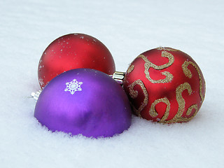 Image showing Christmas decorative balls in snow