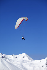 Image showing Paraglider in snowy winter mountains