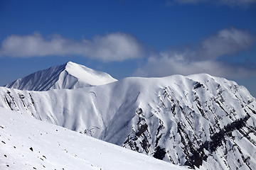 Image showing Off-piste slope with stones and mountains with trace of avalanch