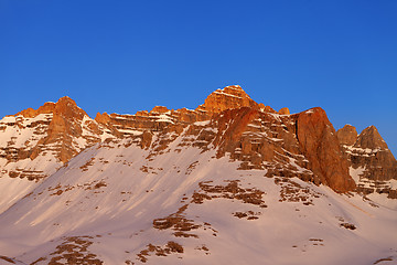 Image showing Sunrise at snowy mountains