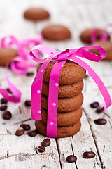 Image showing chocolate cookies tied with pink ribbon and coffee beans 