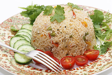 Image showing Tomato biryani and fork