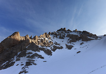 Image showing Group of hikers on snowy slope in early morning