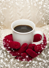 Image showing Woman in Sweater with Red Mittens Holding Cup of Coffee