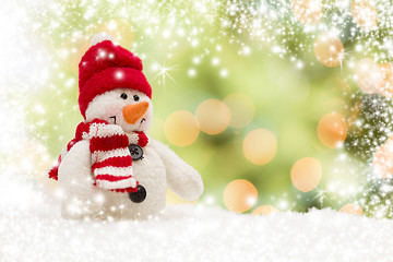 Image showing Cute Snowman Over Abstract Snow and Light Background