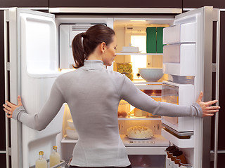 Image showing woman looking for something to eat