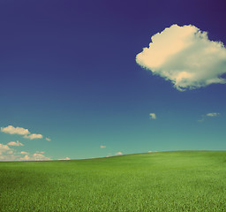 Image showing green hill under blue sky - vintage retro style