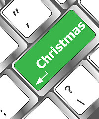 Image showing christmas button on the keyboard key - holiday concept